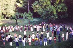 People celebrate in ceremonial circle.